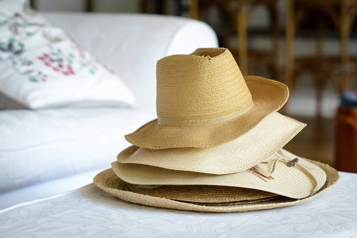Comparison chart showing UV penetration through regular cotton hat vs. certified UPF 50+ hat, with data from Skin Cancer Foundation
